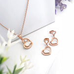 Load image into Gallery viewer, Serenita Set – Twin Heart Rose Gold Necklace &amp; Earrings
